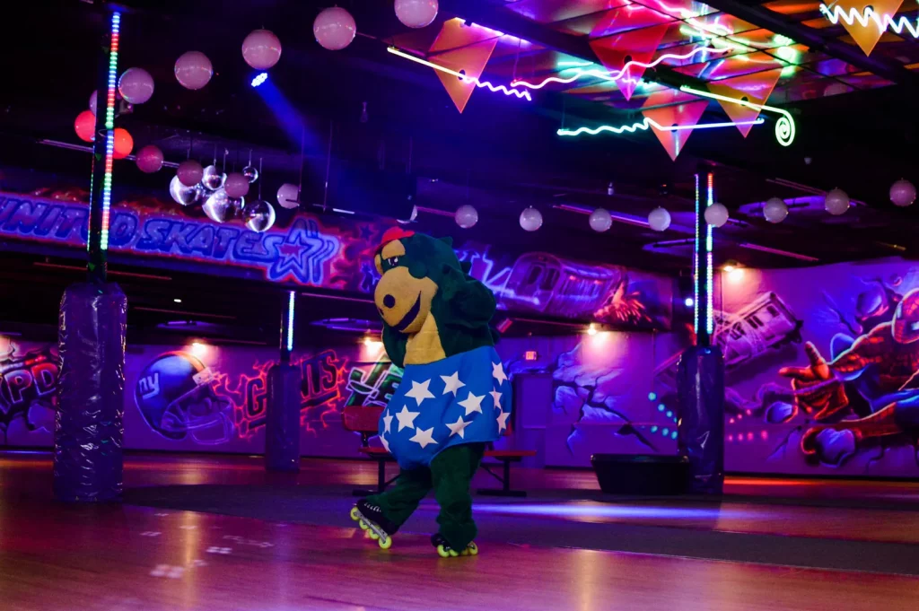 dinosaur mascot on roller skates standing