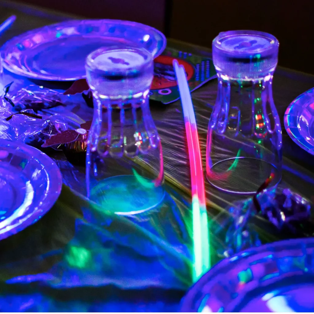table setup with glow stick and party plates