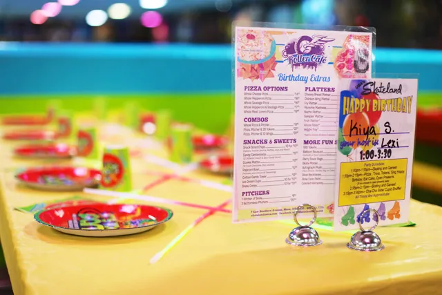 birthday table setup with menu and party plates