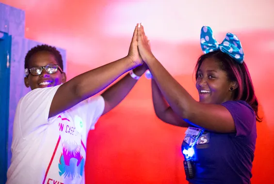 birthday teens high fiving each other