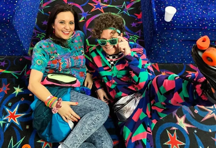 adult couple wearing crazy theme clothing